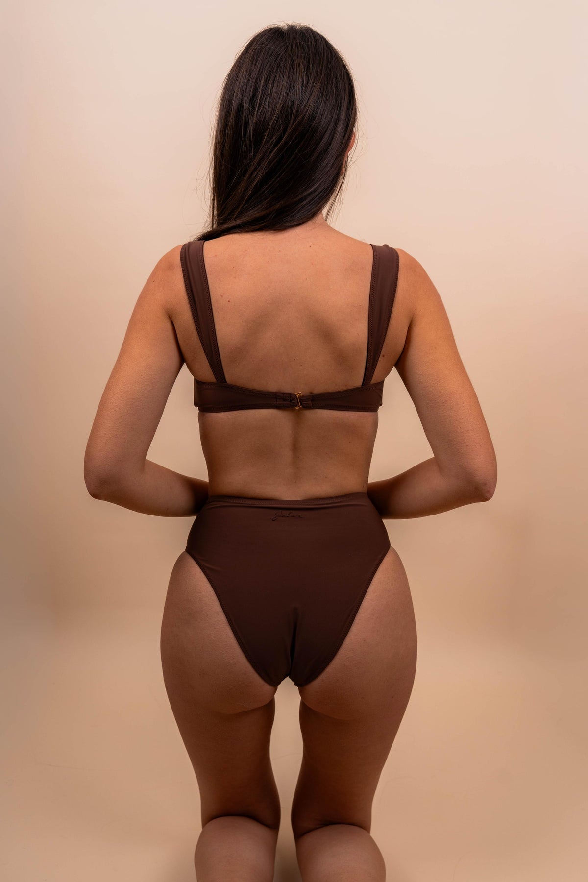 Back view of model wearing the brown TOKA bikini set.